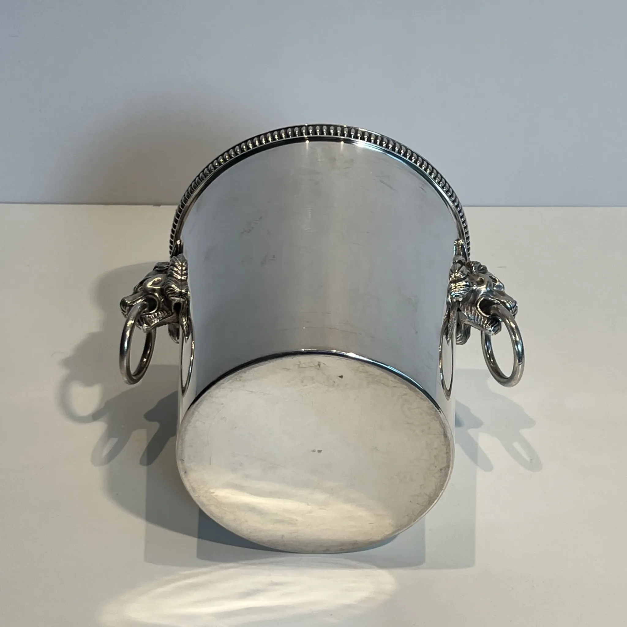 Silver-plated champagne bucket Orfèvrerie Saint-Médard. Handles in the shape of heads.