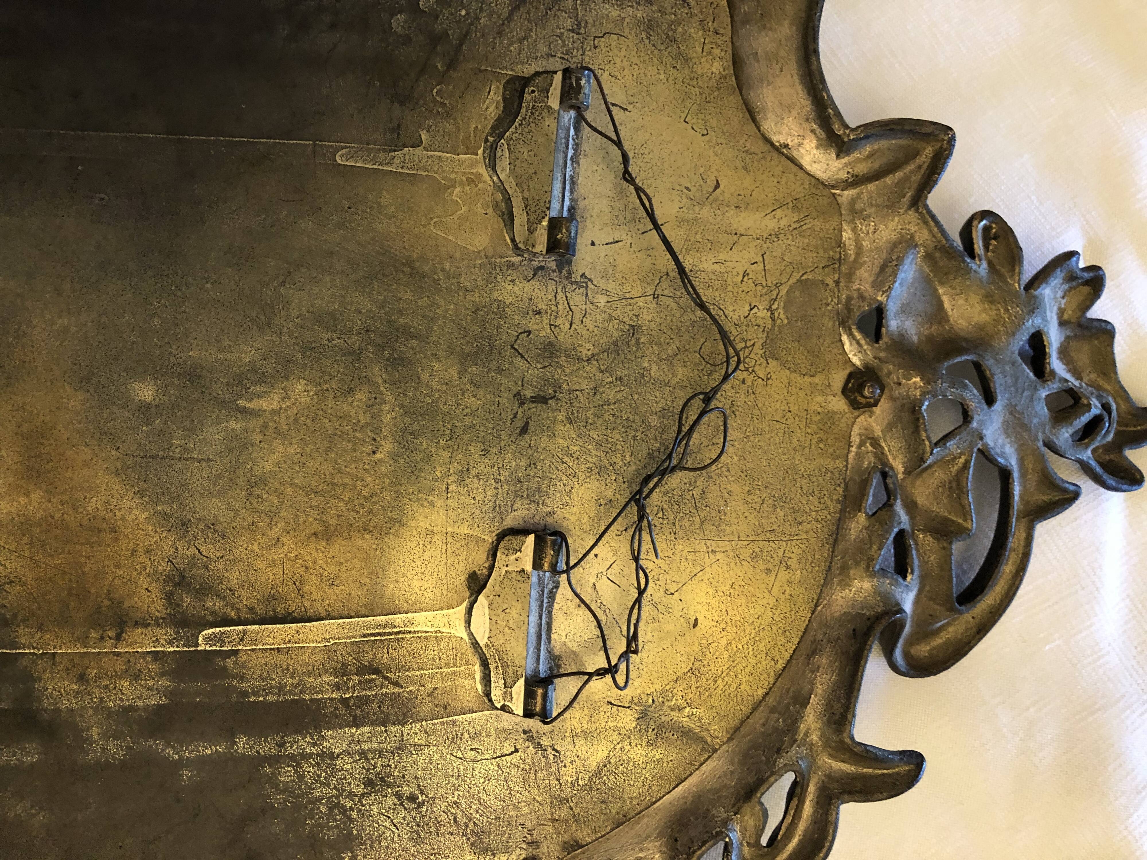 Mirror in gilded bronze and beveled glass 30x48cm