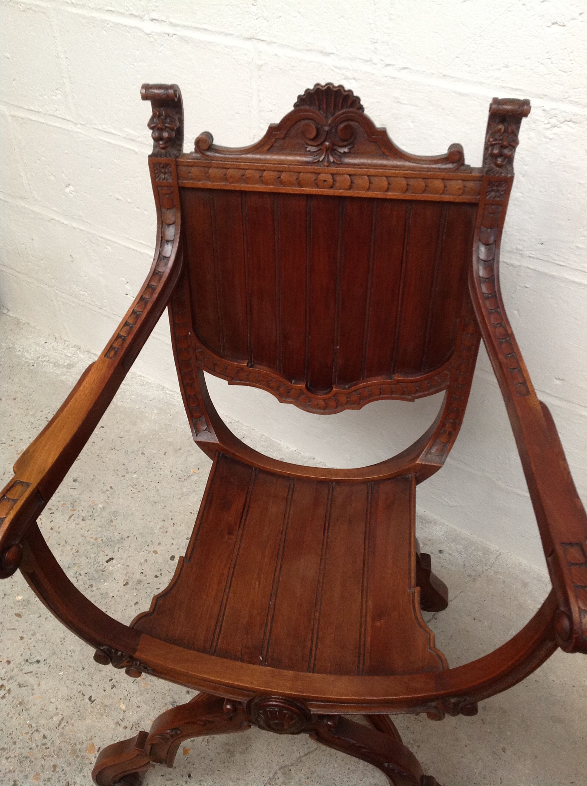 Pair of antique armchairs curules called Dagobert in carved wood