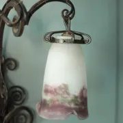 Wall lamp in wrought iron with a pink tulip glass globe by Muller glassworks.