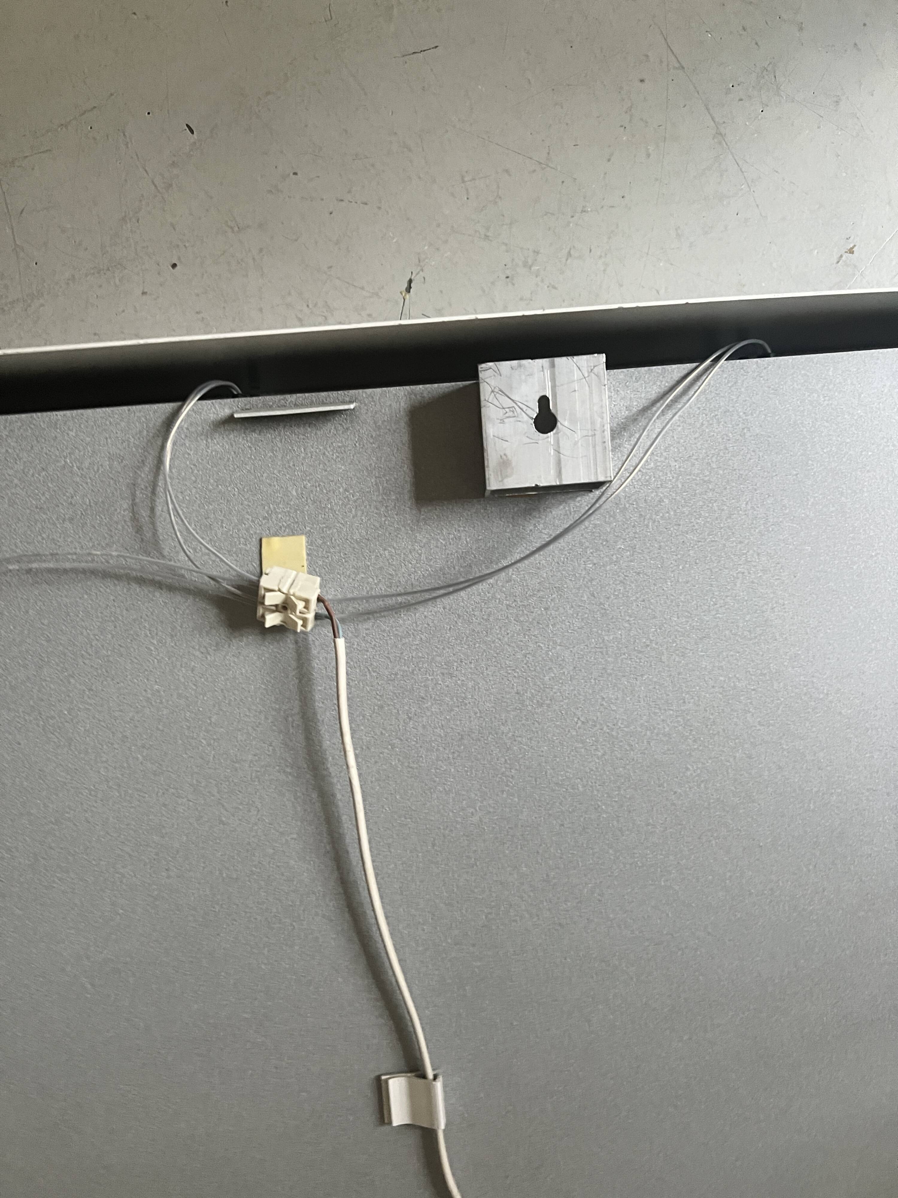 Modernist wall lamp with white metal shade, design by C. Grandidier.