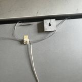 Modernist wall lamp with white metal shade, design by C. Grandidier.