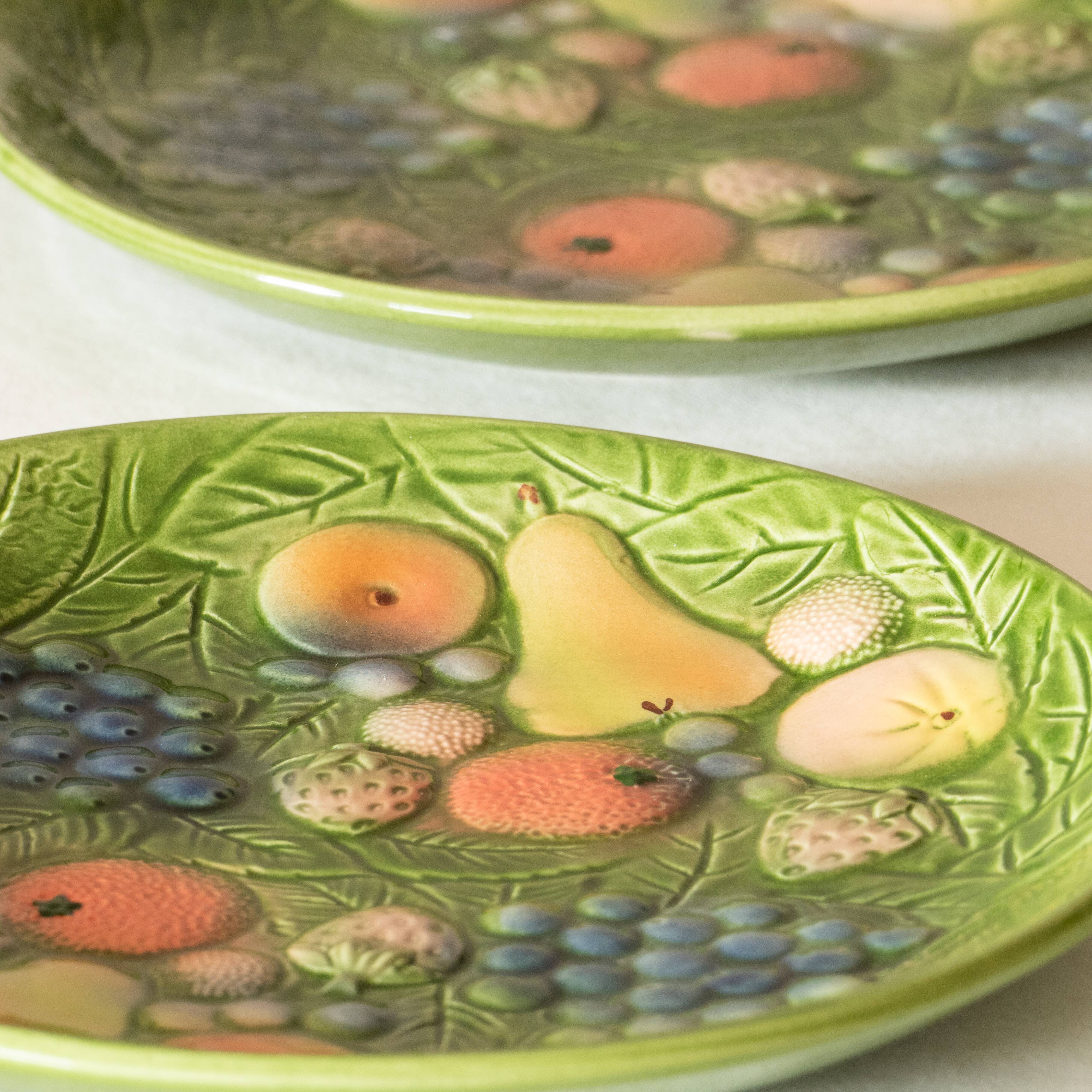 10 antique plates in fruit slip