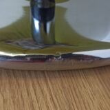 Bucket seat in chrome and green.