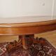 Round walnut table in solid wood, Napoleon III style with extensions - for 14 settings.