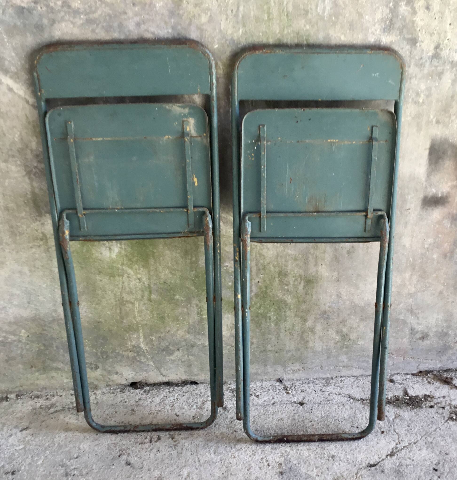 Pair of folding metal chairs, military or industrial, mid-20th century.