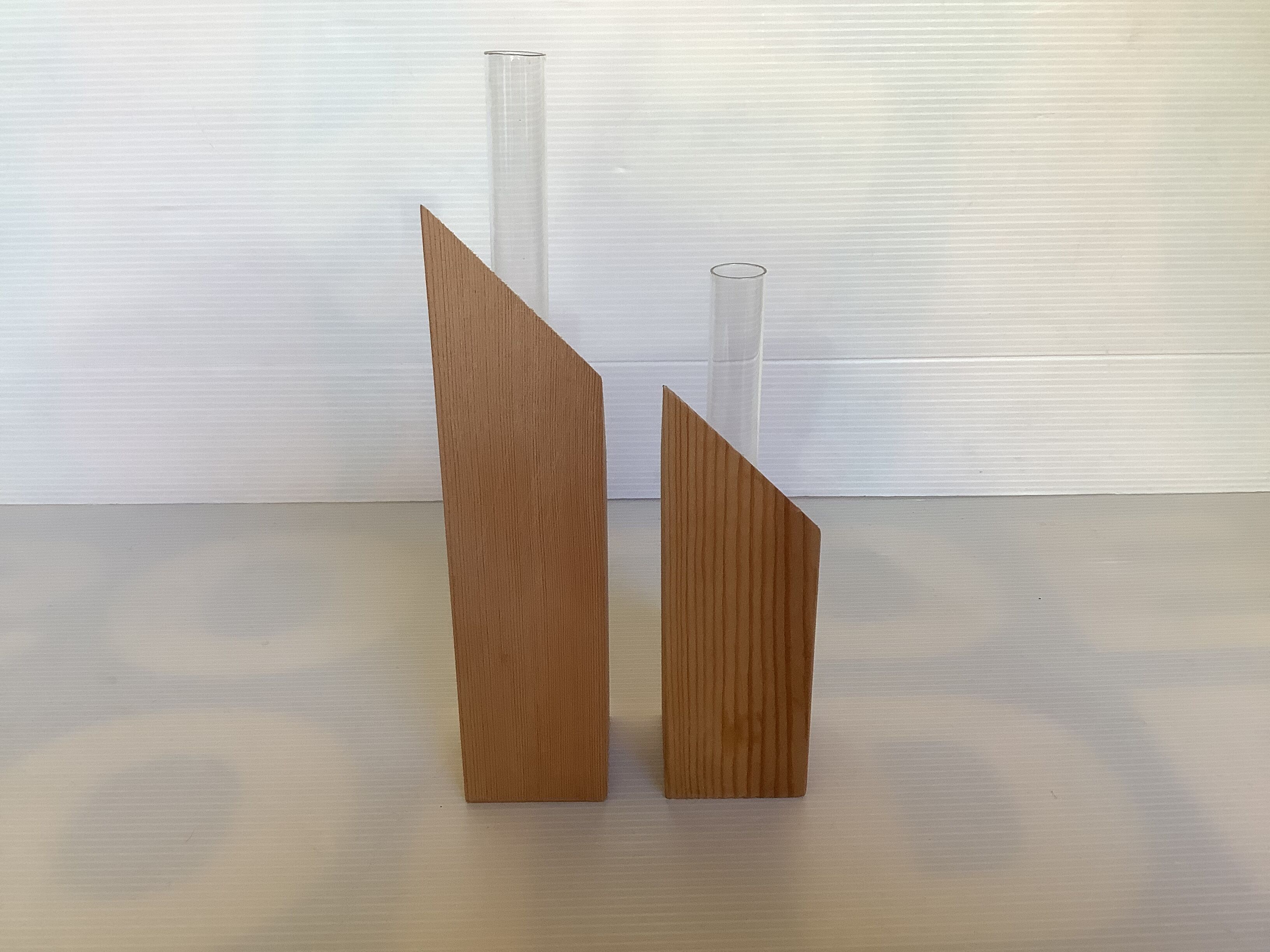 Pair of diamond-shaped wooden Scandinavian test tube vases.