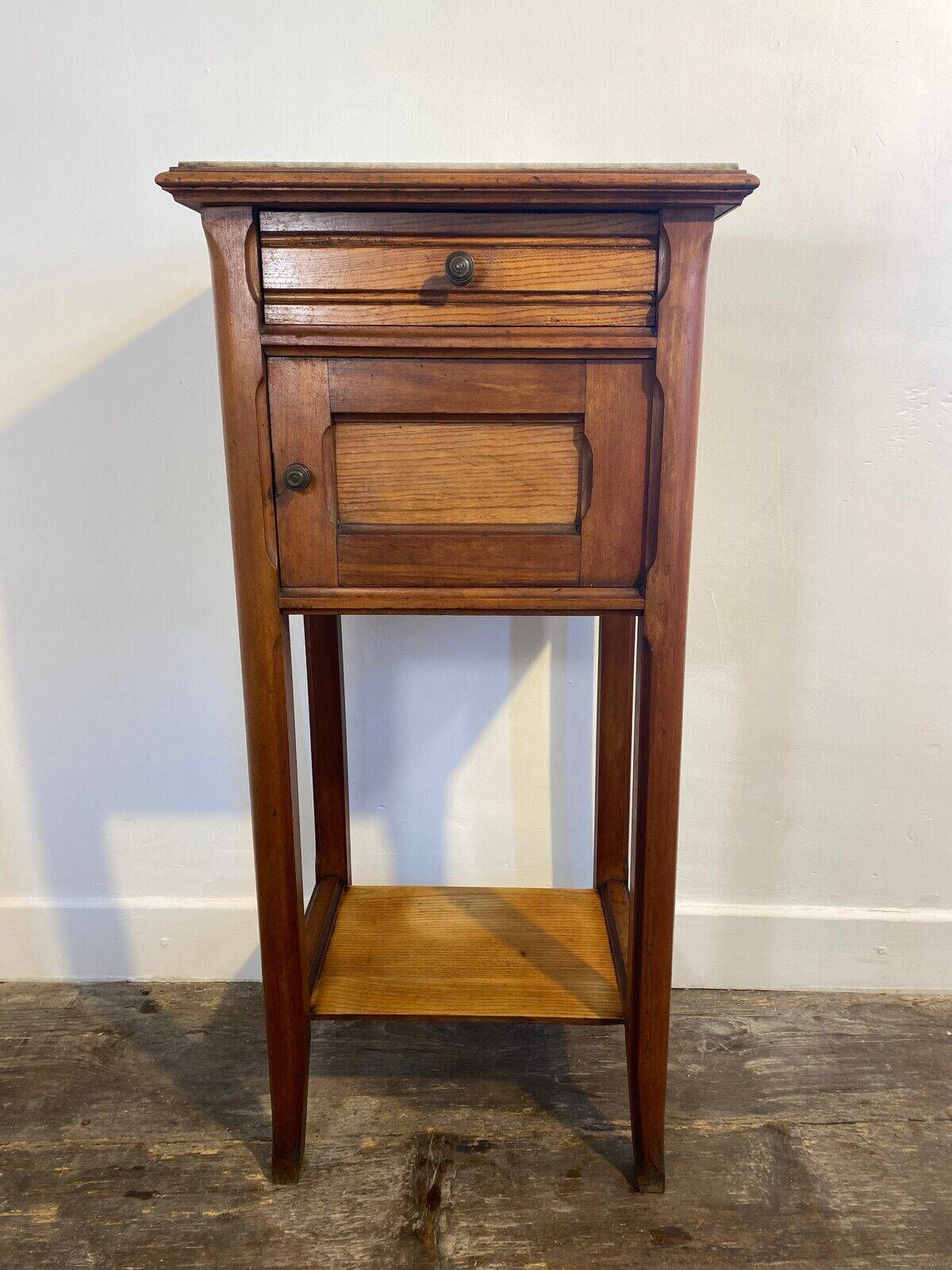 Provincial oak furniture, marble top, ceramic interior.
