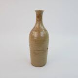 Brown ceramic/stoneware bottle with chiseled floral pattern