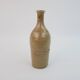 Brown ceramic/stoneware bottle with chiseled floral pattern