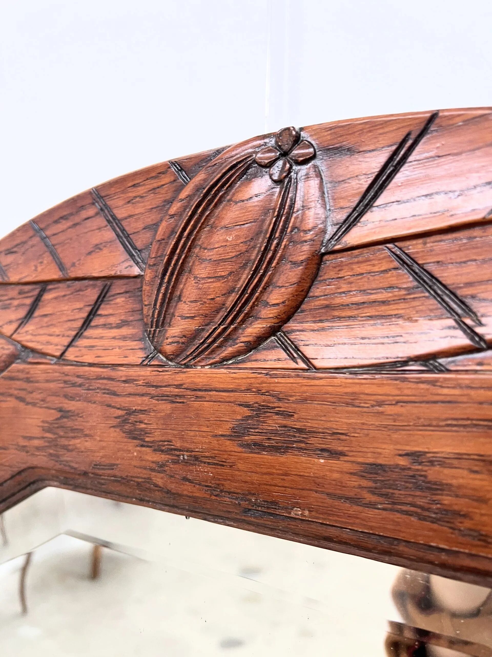 Art Deco oak mirror with carved motif