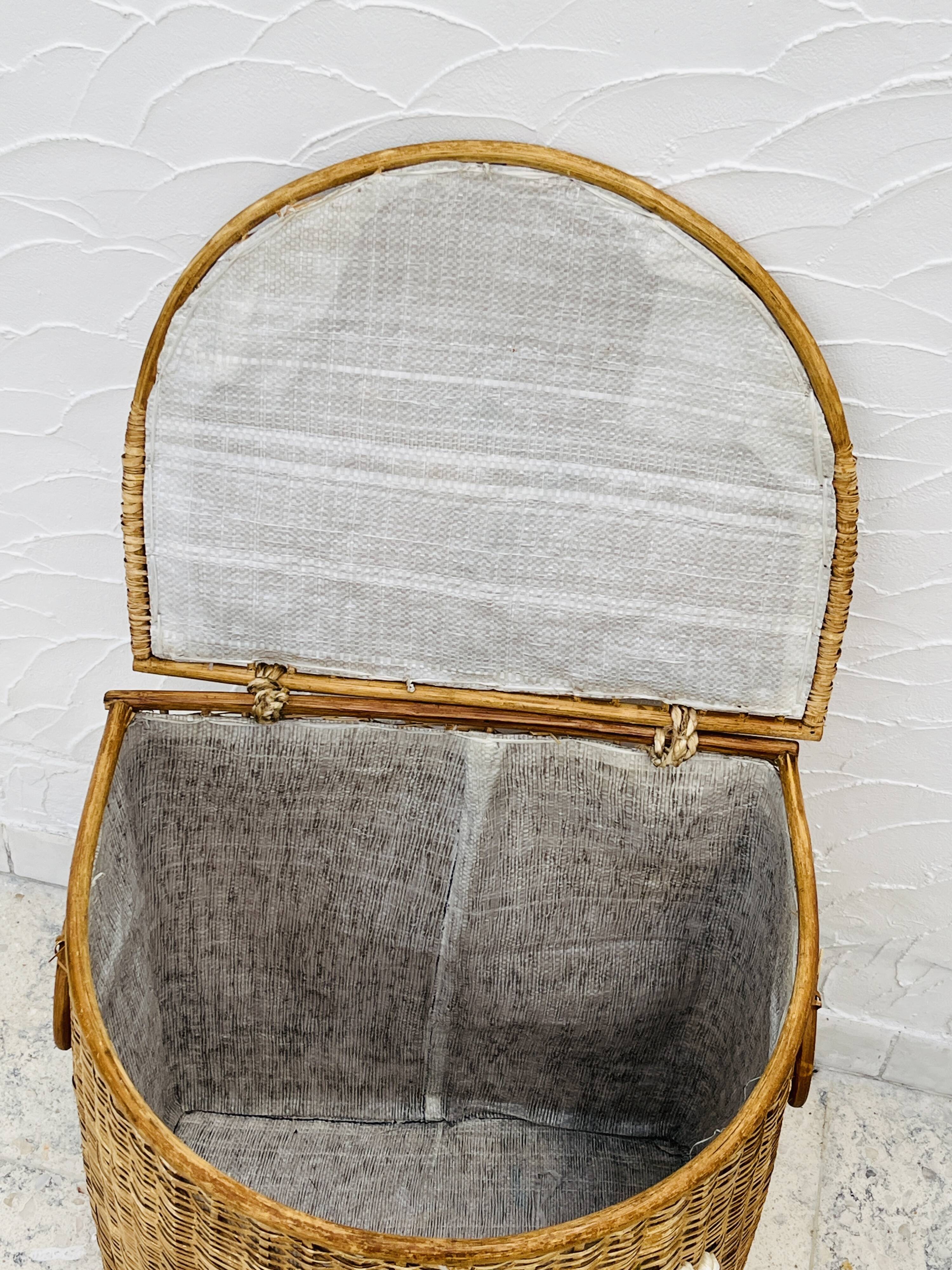 Vintage wicker mannequin with colourful floral decoration.