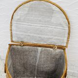 Vintage wicker mannequin with colourful floral decoration.