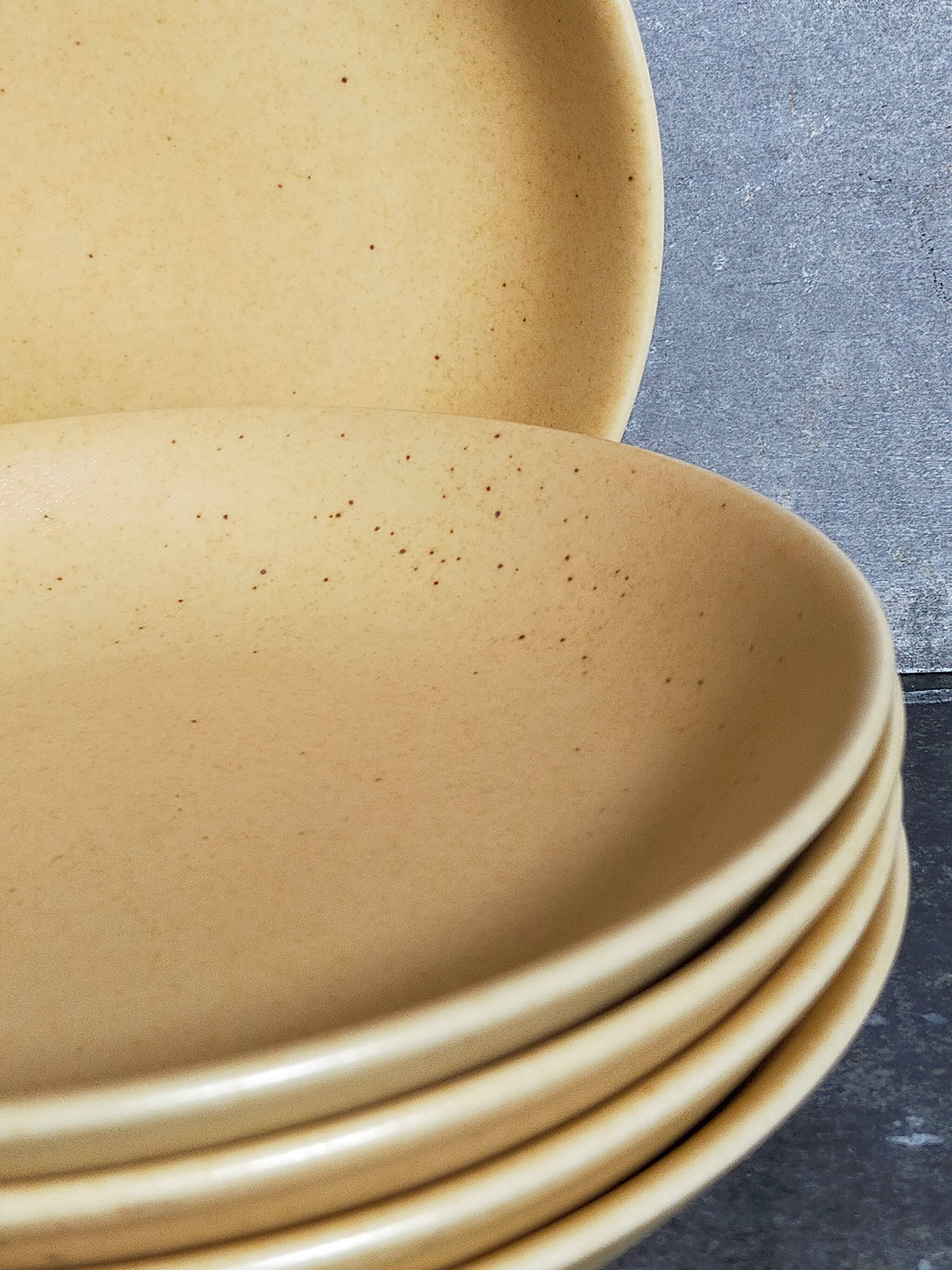Five vintage natural stoneware soup plates