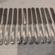 12 silver-plated Empire style table knives 25.3cm