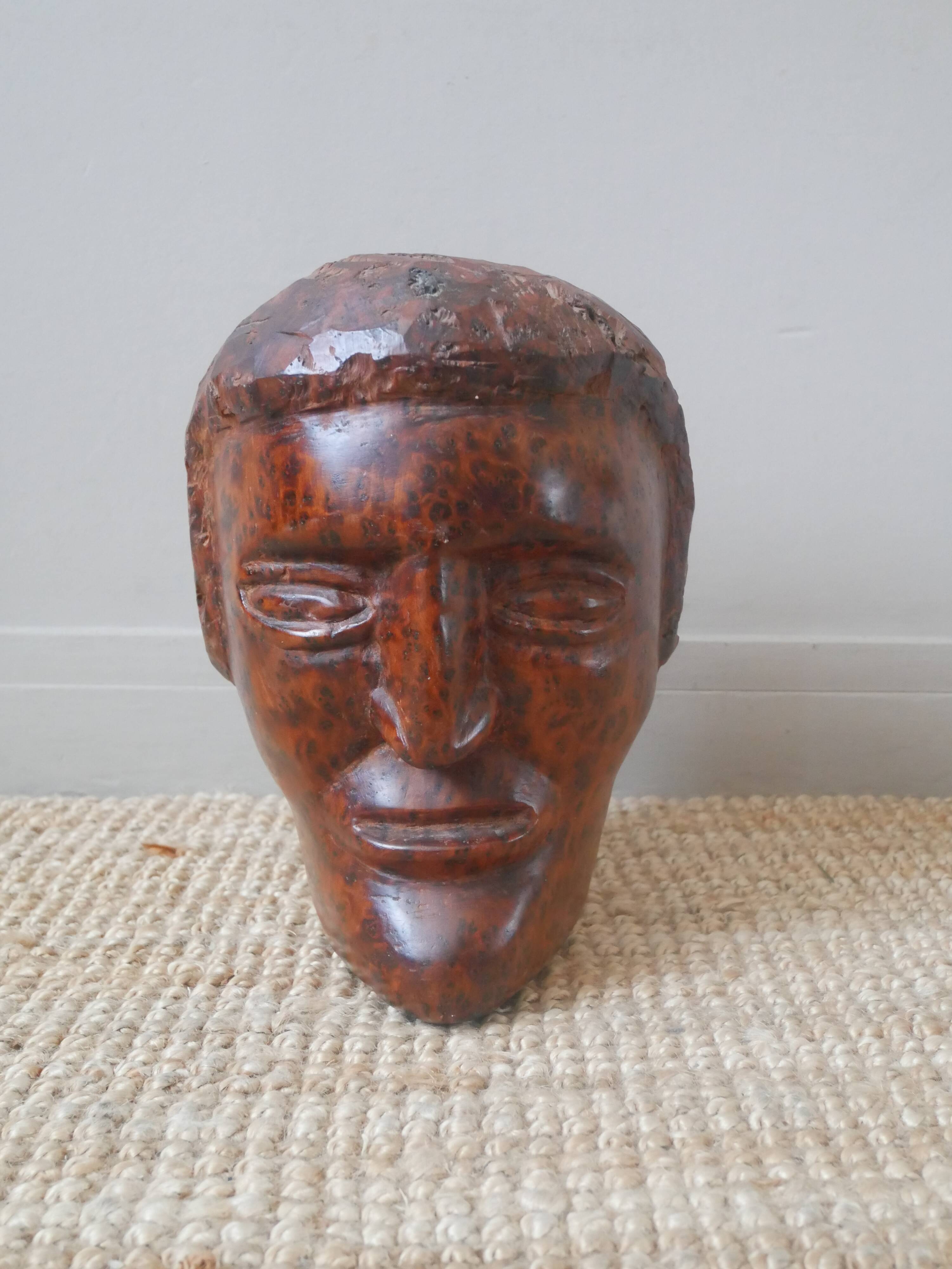 Wooden sculpture ethnic man's head handcrafted tribal decorative object workshop