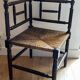 Corner chair made of turned wood with a straw seat.