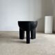 Black mango wood tripod side table with a semi-spherical top, height: 45 cm, diameter: 44 cm.