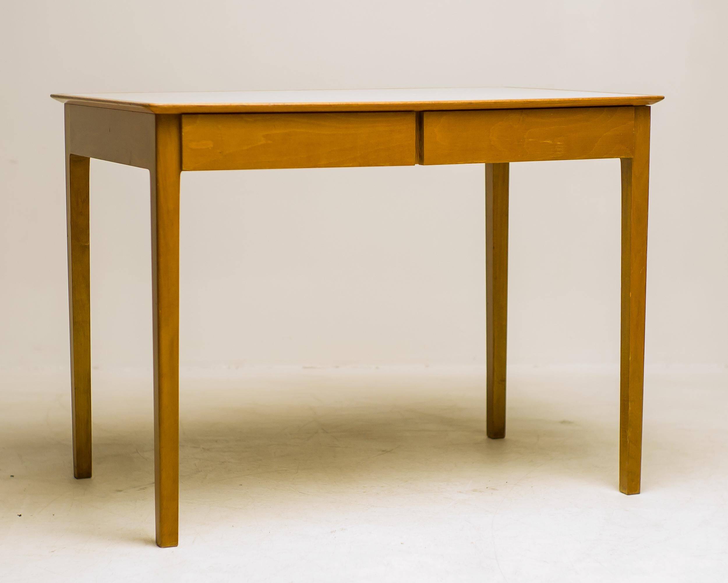 Small maple desk with a laminate top and two drawers, Fritz Hansen, 1950s.