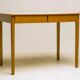Small maple desk with a laminate top and two drawers, Fritz Hansen, 1950s.