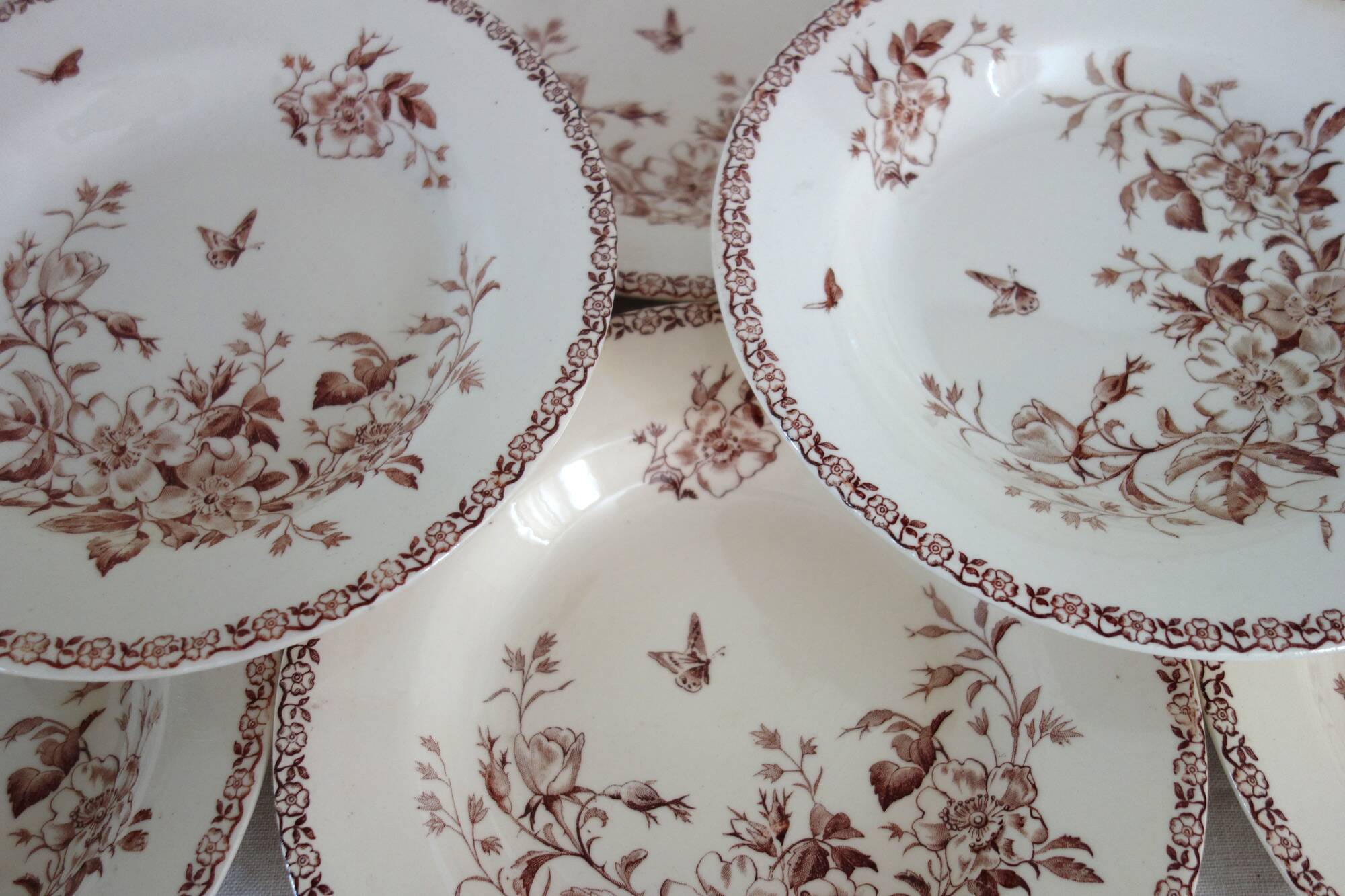 11 deep plates Terre De Fer Gien model Mai circa 1900