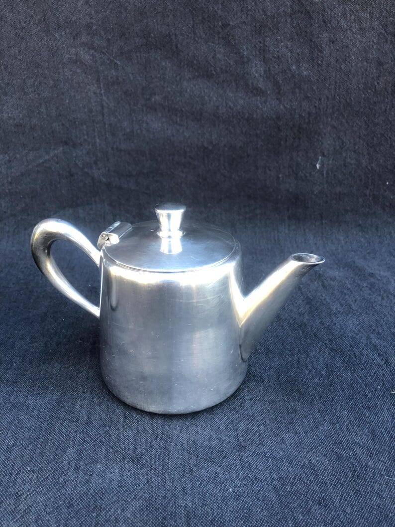 A pair of vintage silver-plated teapot and coffee pot
