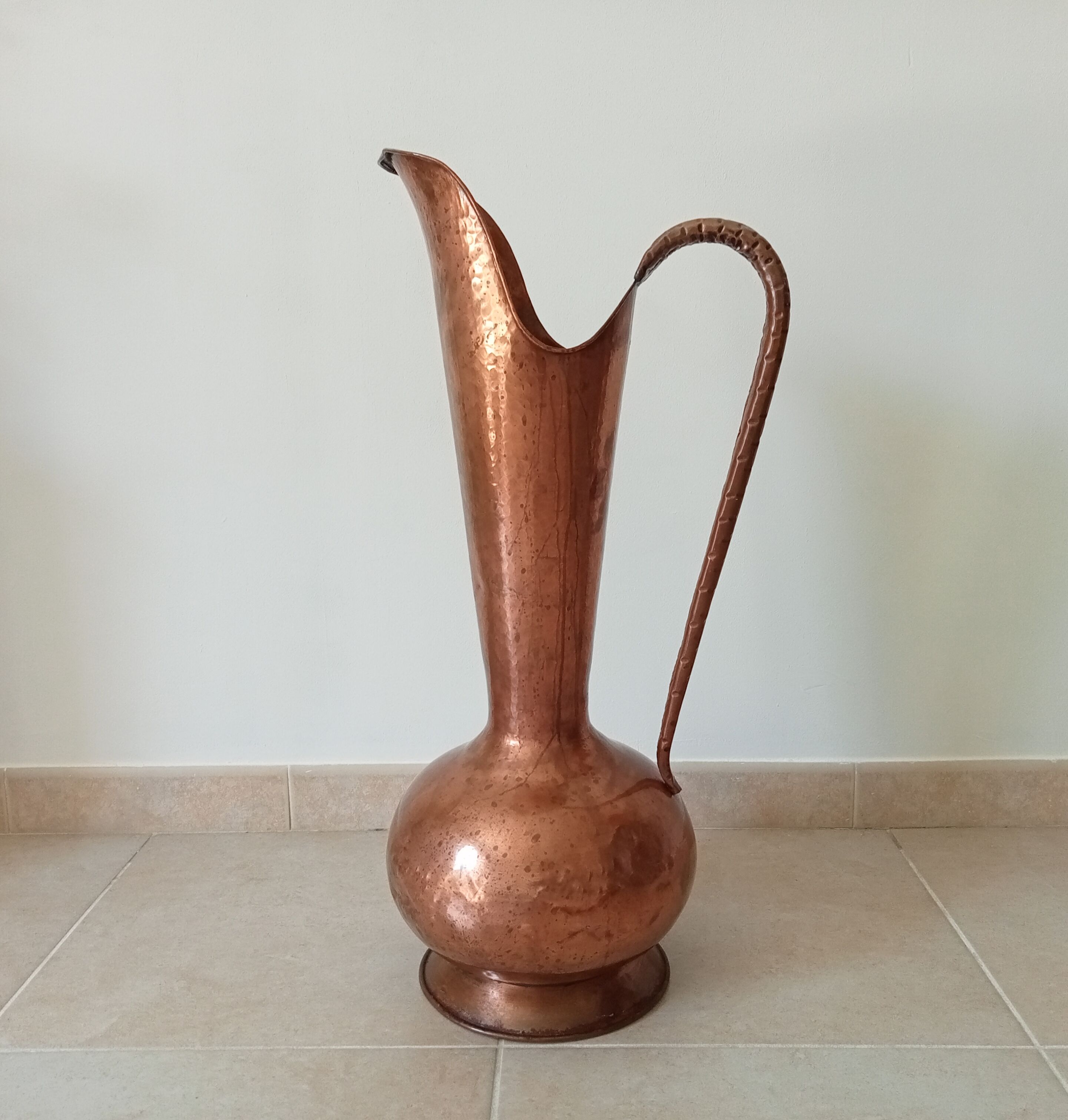 Old italian amphora vase in hammered copper