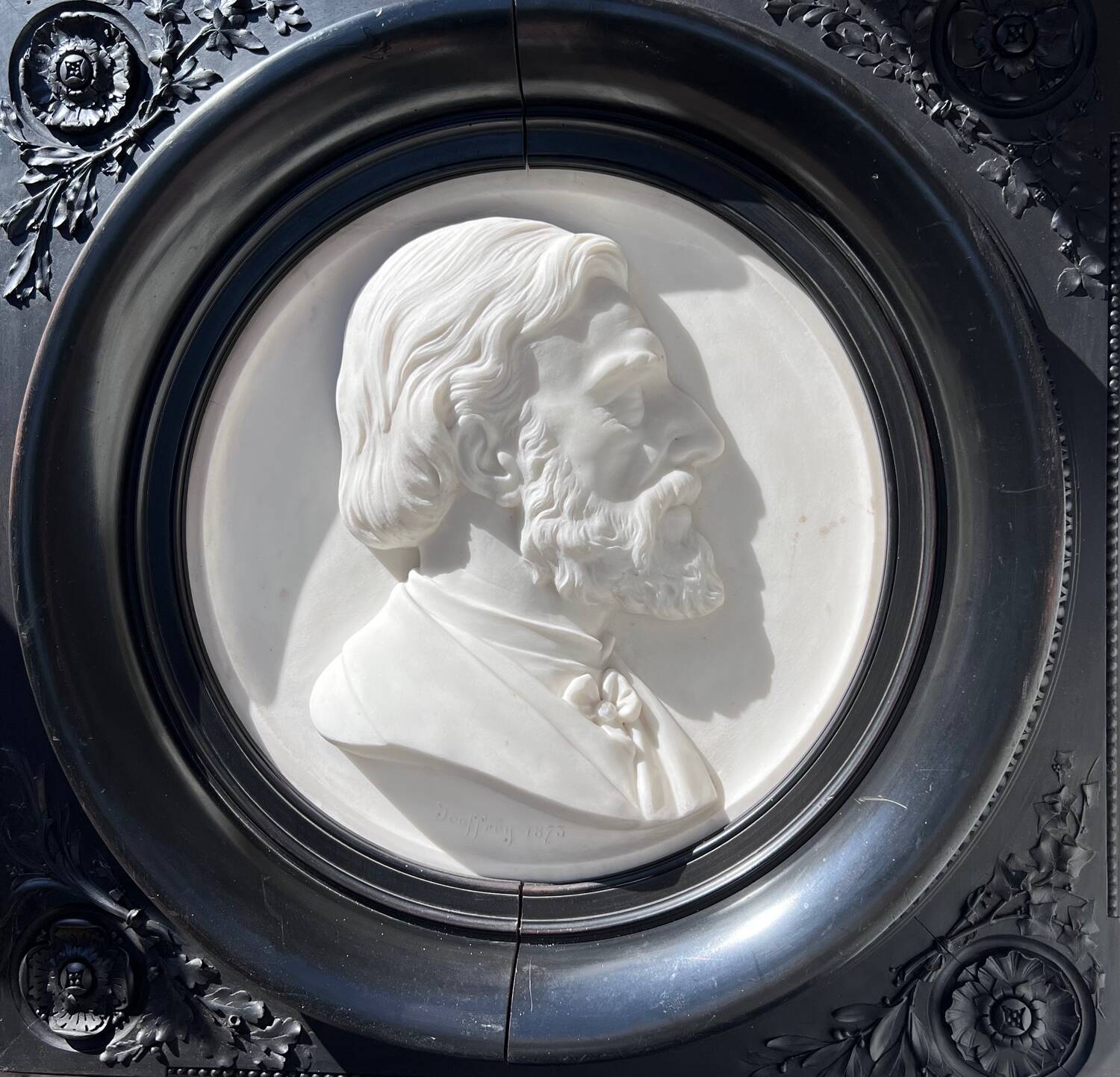 Bas-relief in marble and carved ebony signed Jouffroy, 1873