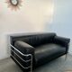 Old vintage leather and tubular metal sofa, design 70s
