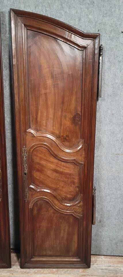 Pair of Louis XV period molded doors in solid walnut