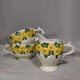 Sunflower flower cups and milk jug