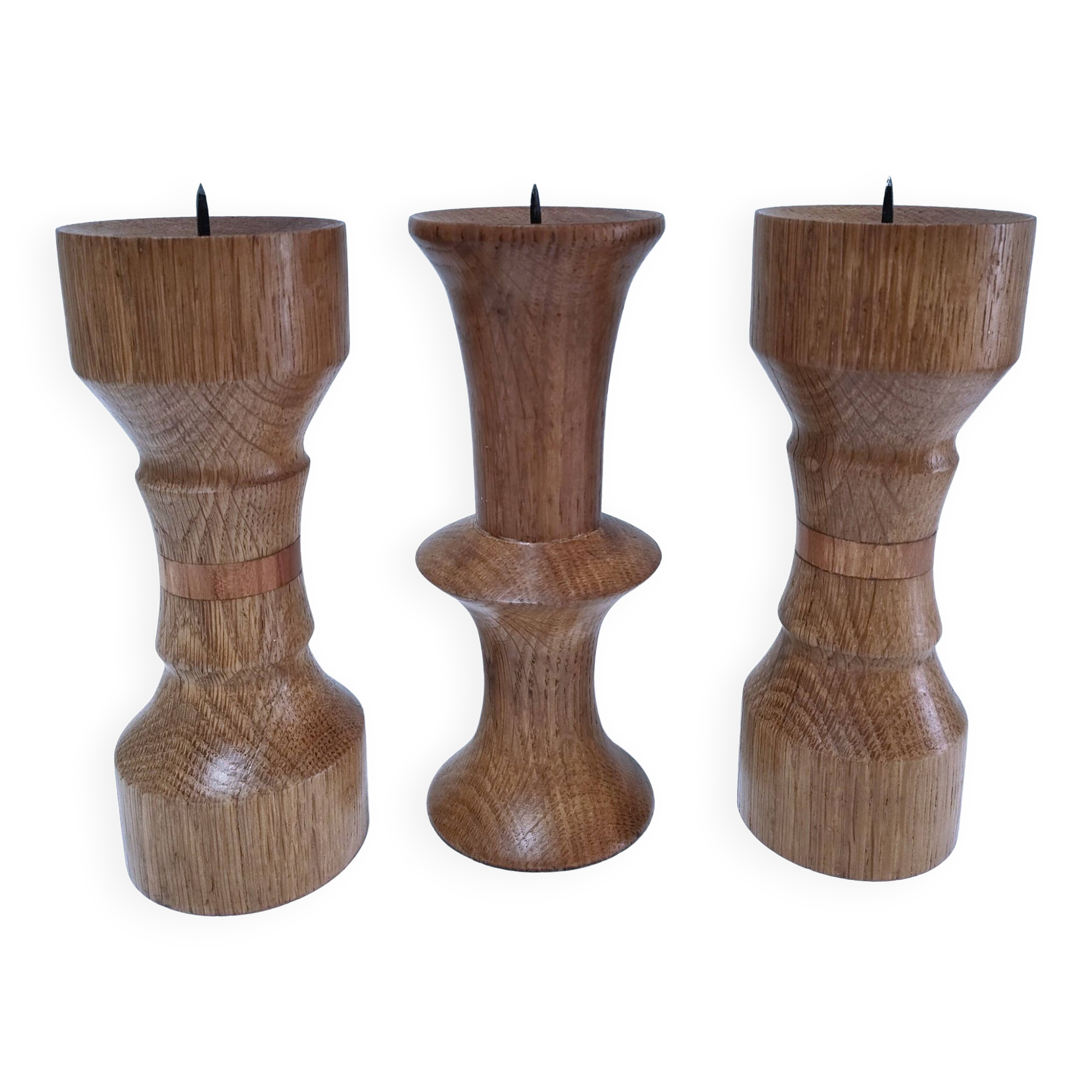 Three vintage patinated solid wood candlesticks