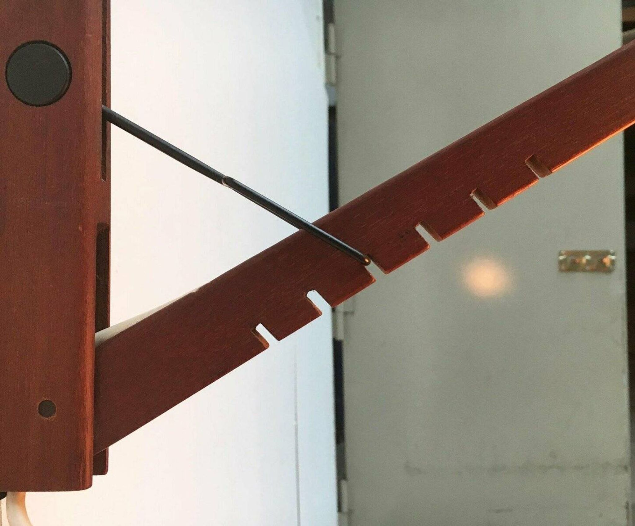 Mid-century pivoting wall lamp with a swing arm, Cocoon, made of teak wood, 1960s.