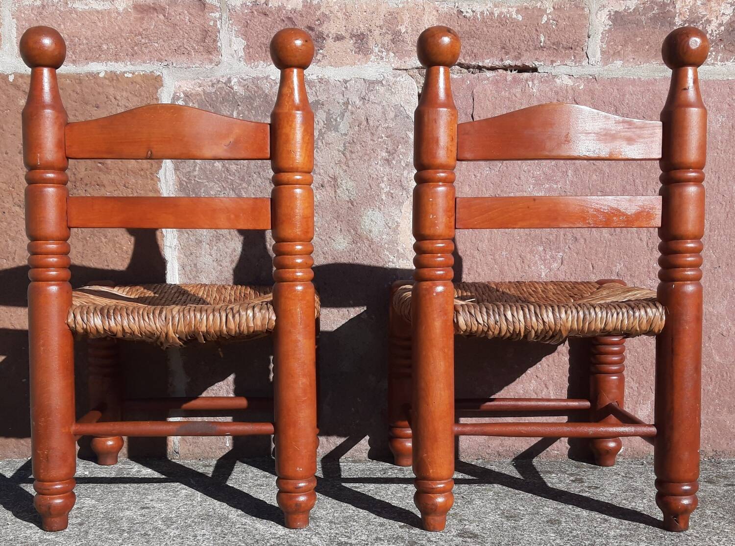 Pair of low armchairs by the fireplace. (Straw seat)