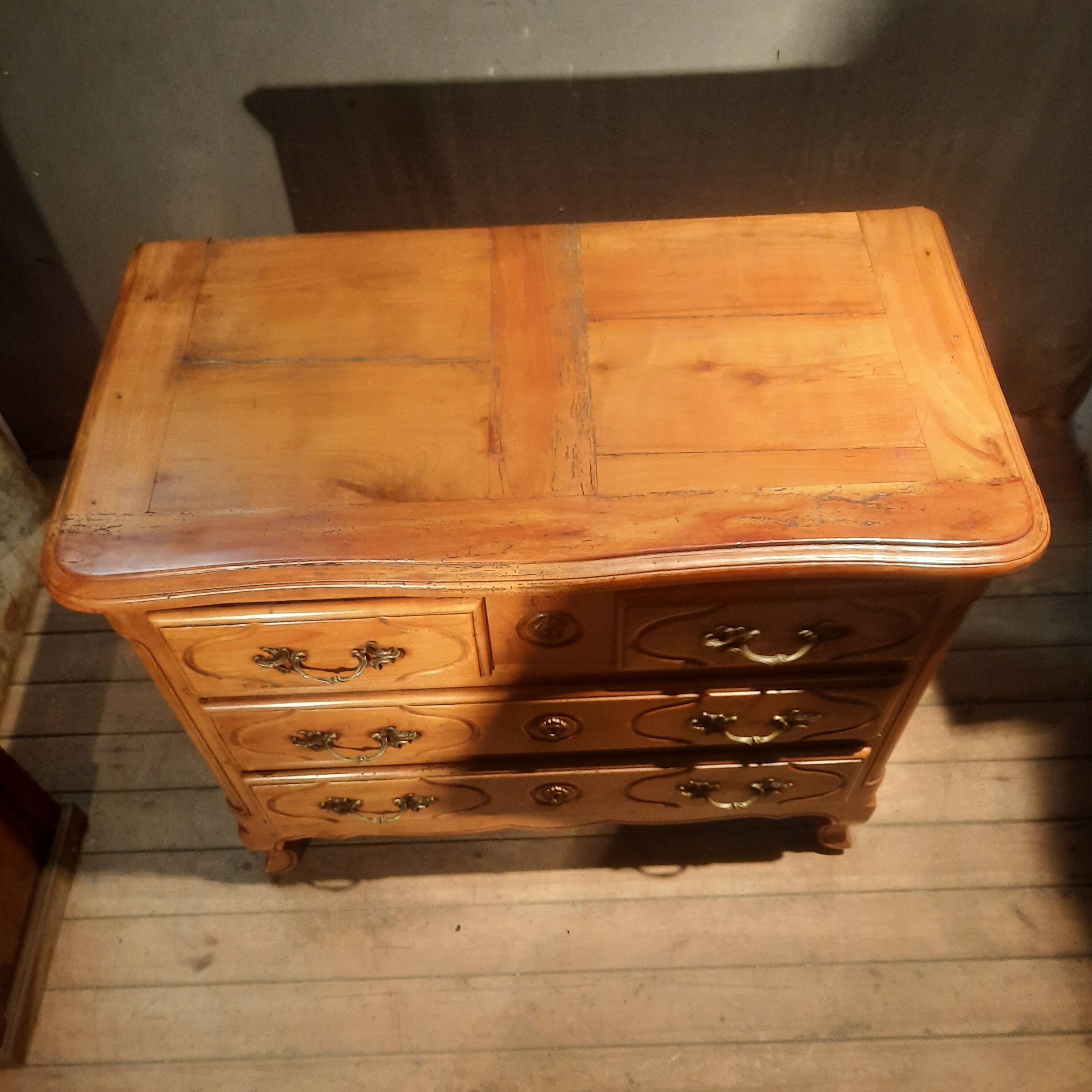 Louis XIV style commode in solid cherry wood.