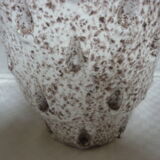 Spotted white ceramic vase with hollow form of tears
