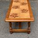 Solid wood and ceramic coffee table from the 1970s.
