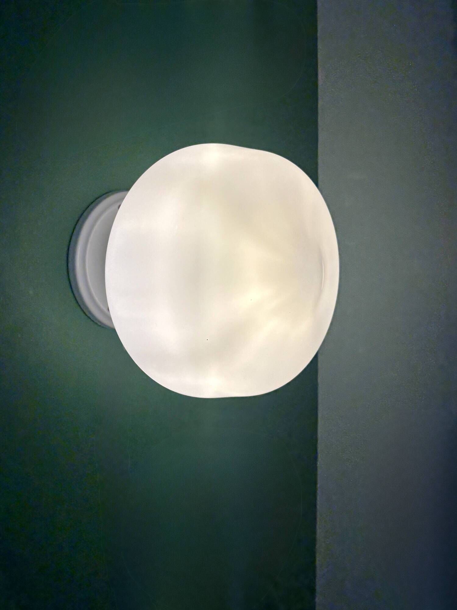 Vintage Art Deco globe wall light in white opaline.