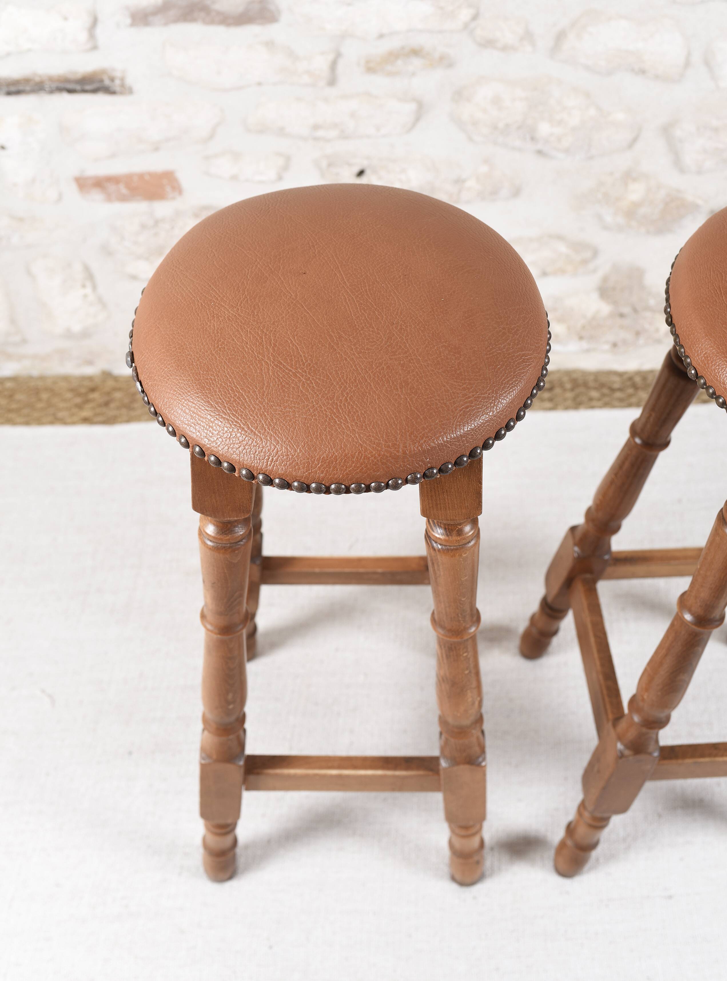 Antique bar stools, brown leather and wood
