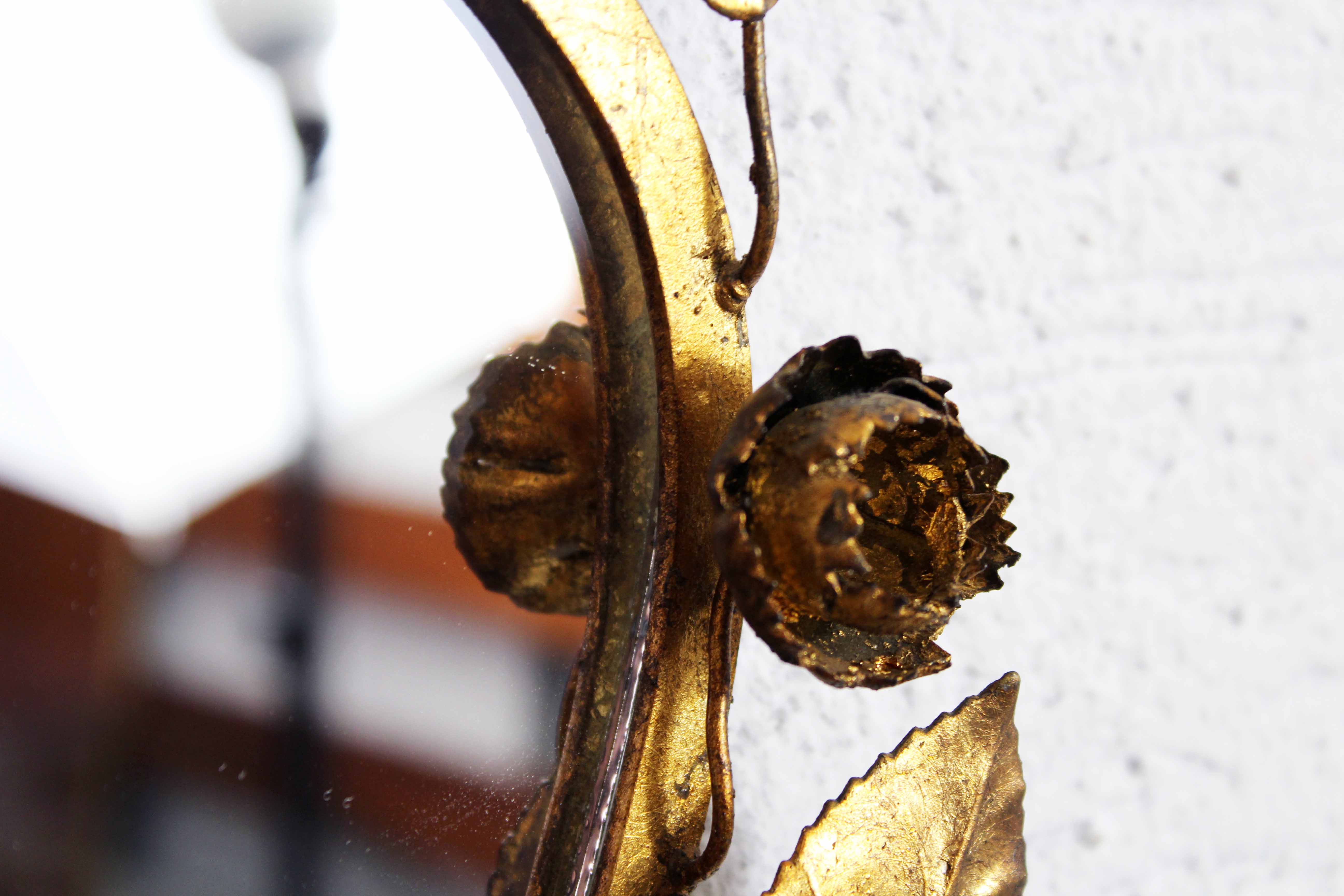 Old candlestick mirror gilded with leaf
