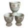 Three egg cups with geometric patterns in beige and brown.