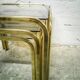 Trio of gilded metal trundle tables