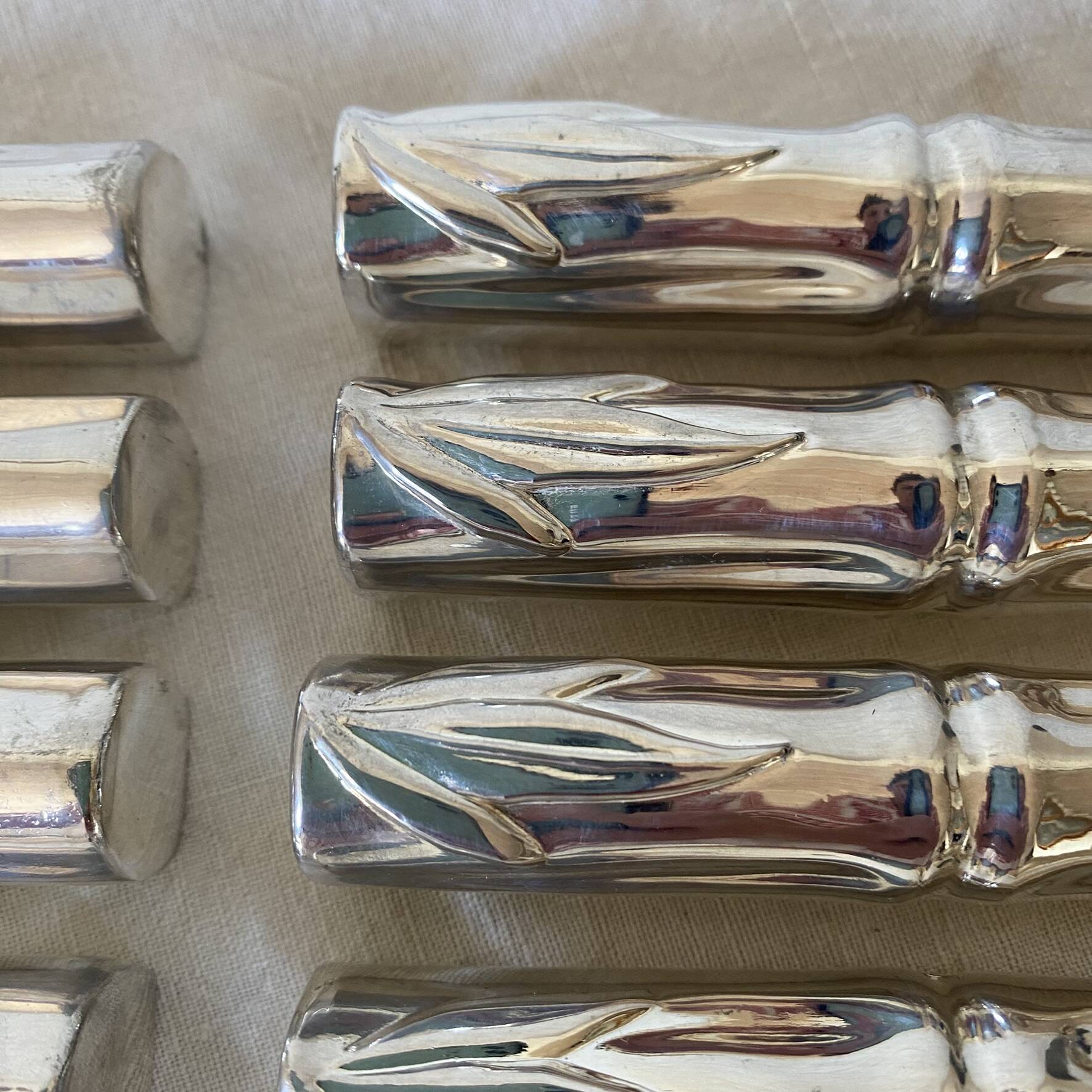 Silver bamboo knife rests from the 1980s.