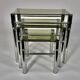 Tables in chrome metal and tinted glass. year 70