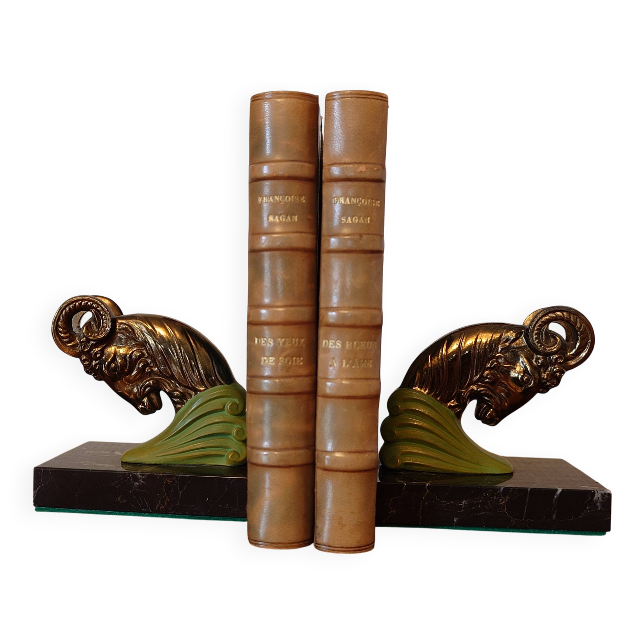 Art Deco pair of bookends with ram's heads, patinated metal and black marble.