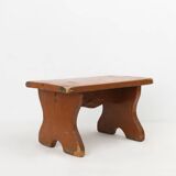 French rustic low church stool in terracotta painted wood, ca. 1900