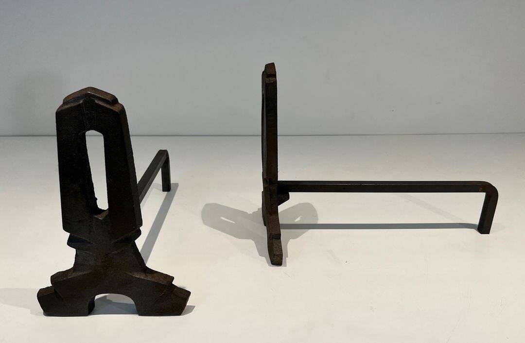 Pair of Modernist Andirons in Cast Iron with Openwork Uprights and Tripod Bases