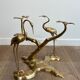 Coffee table model with cranes surrounding a brass bonsai and round glass top by Willy Daro.