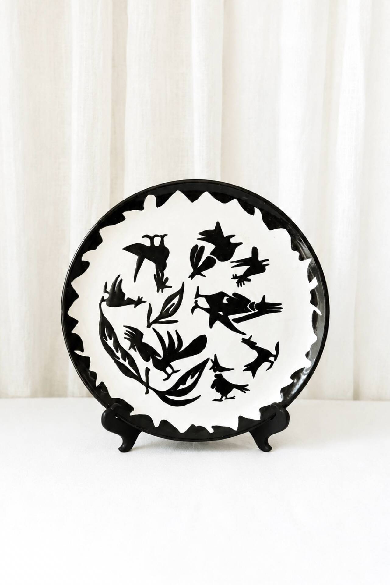 Large ceramic plate J. Lurçat with zoomorphic decoration in black on a white background.