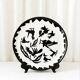 Large ceramic plate J. Lurçat with zoomorphic decoration in black on a white background.